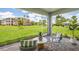 Screened-in patio with comfortable seating and a view of the lawn at 2133 Royal Tern Cir, Punta Gorda, FL 33983
