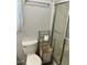 Bathroom with shower stall, toilet, and linen storage at 406 Trento, Venice, FL 34285