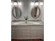 Double vanity bathroom with granite countertop at 406 Trento, Venice, FL 34285