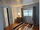 Comfortable bedroom with a double bed, wood floors, and a window at 406 Trento, Venice, FL 34285