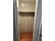 Small closet with wood paneling and shelving at 406 Trento, Venice, FL 34285