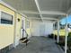 Covered patio with access to the house and a storage room at 406 Trento, Venice, FL 34285