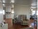 Modern kitchen featuring white cabinets, granite countertops, and mosaic backsplash at 406 Trento, Venice, FL 34285