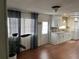 Updated kitchen with white cabinets and a view into living room at 406 Trento, Venice, FL 34285