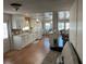 Open concept kitchen with white cabinets and wood flooring at 406 Trento, Venice, FL 34285