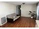 Living room with futon and wood-look flooring at 406 Trento, Venice, FL 34285