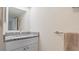 Bathroom vanity with granite countertops and ample storage, creating a functional and elegant space at 8 Quails Run Blvd # 6, Englewood, FL 34223