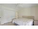 Cozy bedroom with a closet, and doorway offering a comfortable and organized living space at 8 Quails Run Blvd # 6, Englewood, FL 34223