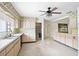 Retro kitchen with light wood cabinets and terrazzo flooring at 2026 Pine Ter, Sarasota, FL 34231