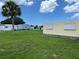 View of the lot with surrounding homes and vegetation at 406 Trento, Venice, FL 34285