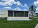Enclosed Florida room with screened windows, adding extra living space at 406 Trento, Venice, FL 34285