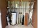 Unfinished basement area with water heater and storage at 406 Trento, Venice, FL 34285