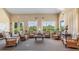 Relaxing community lounge with wicker chairs and a large window at 2129 Royal Tern Cir, Punta Gorda, FL 33983