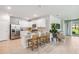 Modern kitchen with white cabinets, stainless steel appliances, and breakfast bar at 2129 Royal Tern Cir, Punta Gorda, FL 33983