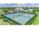 Community tennis courts with surrounding landscape at 2129 Royal Tern Cir, Punta Gorda, FL 33983
