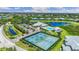 Aerial view of community tennis courts and clubhouse at 2129 Royal Tern Cir, Punta Gorda, FL 33983