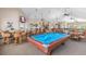 Spacious recreation room with a pool table and ample seating for residents at 2129 Royal Tern Cir, Punta Gorda, FL 33983