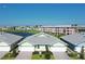 Community overview featuring multiple villas and a lake at 2129 Royal Tern Cir, Punta Gorda, FL 33983
