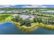 Community clubhouse and pool area next to a lake at 2129 Royal Tern Cir, Punta Gorda, FL 33983