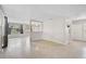 Living area with grey walls, carpet, and access to other rooms at 2143 Starlite Ln, Port Charlotte, FL 33952