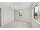 Comfortable bedroom featuring neutral walls and carpet, with a double-door closet and window at 2143 Starlite Ln, Port Charlotte, FL 33952