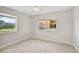 Spacious bedroom with neutral walls, carpet flooring, and a ceiling fan at 2143 Starlite Ln, Port Charlotte, FL 33952