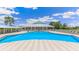 Relaxing community pool with a large deck at 2133 Royal Tern Cir, Punta Gorda, FL 33983