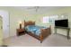 Bedroom with queen bed, ceiling fan and window at 1840 Vera Pl # 81, Sarasota, FL 34235