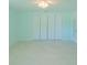 Spacious bedroom with light walls and large closet at 1201 Cypress Ave, Venice, FL 34285