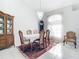 Formal dining room with wood table and hutch at 490 Lake Of The Woods Dr, Venice, FL 34293