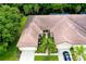 Aerial view of condo with private courtyard and two-car garage at 11103 Batello Dr, Venice, FL 34292