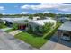 Aerial view of a single-Gathering home in a residential community at 107 Tahitian Way, North Port, FL 34287