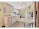 Clean kitchen featuring white cabinets and modern appliances at 107 Tahitian Way, North Port, FL 34287