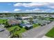Aerial view of community center, pool, and tennis courts at 107 Tahitian Way, North Port, FL 34287