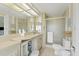 Clean bathroom with shower, toilet and updated vanity at 107 Tahitian Way, North Port, FL 34287