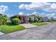 Attractive manufactured home with covered carport at 107 Tahitian Way, North Port, FL 34287