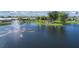 Aerial view of community lake with fountain and gazebo at 107 Tahitian Way, North Port, FL 34287