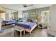 Bright bedroom with a comfortable bed and mirrored closet at 107 Tahitian Way, North Port, FL 34287