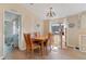 Cozy dining area with a wooden table and cat tree at 107 Tahitian Way, North Port, FL 34287