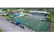 Aerial view of pickleball and tennis courts in community at 107 Tahitian Way, North Port, FL 34287