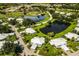 Augusta Villas community aerial, featuring numerous homes, ponds, and a golf course at 126 Wexford Way # 118, Venice, FL 34293