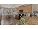 Spacious kitchen with granite countertops, stainless steel appliances, and an island at 20193 Pezzana Dr, Venice, FL 34292
