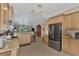 Modern kitchen with stainless steel appliances and granite countertops at 20193 Pezzana Dr, Venice, FL 34292