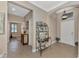 Bright foyer with tile floors and decorative shelving at 20193 Pezzana Dr, Venice, FL 34292