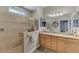 Elegant bathroom with dual sinks and a walk-in shower at 20193 Pezzana Dr, Venice, FL 34292