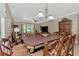 Open dining area features a large table and views into the living room and kitchen at 20193 Pezzana Dr, Venice, FL 34292