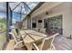 Enjoy this screened patio with dining and seating areas at 20193 Pezzana Dr, Venice, FL 34292