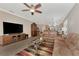 Bright living room with open concept floor plan and ceiling fan at 20193 Pezzana Dr, Venice, FL 34292