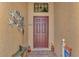 Home entry with brown door and starfish decor at 20193 Pezzana Dr, Venice, FL 34292