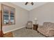 Bright office space with hardwood floors and two armchairs at 20193 Pezzana Dr, Venice, FL 34292